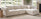how to choose a sofa buying guide blog banner features cream 4 seat chaise sofa in light modern living room in front of window and fireplace