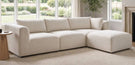 how to choose a sofa buying guide blog banner features cream 4 seat chaise sofa in light modern living room in front of window and fireplace
