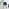 Novara Black Leg Round Glass Dining Table & 4 Blue Falun Black Leg Chairs