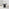 Penrose Black Round Dining Table & 4 Green Layla Fabric Swivel Chairs