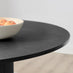 Penrose Black Round Dining Table & 4 Cream Beaumont Fabric Swivel Chairs