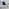 Enna White Glass Extending Dining Table and 4 Navy Pesaro Silver Leg Chairs