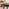 Koko Walnut Effect Round Dining Table & 4 Black Corona Black Leg Chairs