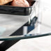 Novara Black Leg Round Glass Dining Table & 4 Green Pesaro Black Leg Chairs